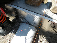 Barbwire is tied to wire put into the foundation before pouring the cement.
MVG