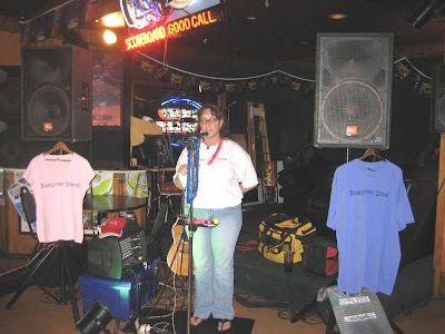 Our current Prez Kathleen on stage doing presidential things like giving a welcome y'all speech and drawing for raffle prizes.