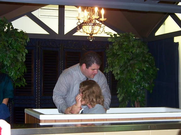Pastor Randy Pate prepares to baptize a new believer in Jesus' name during Calvary Tabernacle's first service at 1125 Hampshire.