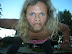 Scary being - Something hit my windshield while we were driving down the highway. I made a picture of this creature.