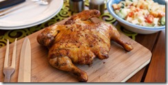 Whole cooked chicken served with salad