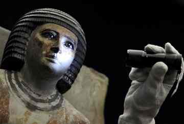 A restorator illuminates the face of the statue of Kai, an ancient Egyptian territorial civil servant, with a torch light during the preparations for an exhibition at the Liebighaus in Frankfurt/Main, Germany. The exhibition 'Sahure - Death and Life of a great Pharaoh' wil open to the public from 24 June to 28 November. Sahure reigned as king of ancient Egypt's 5th dynasty between 2458 and 2446 BC. Sahure stood out politically and culturally and is a prominent representative of the so-called Old Kingdom.