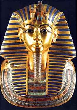 The solid gold death mask of Tutankhamun is inlaid with semi-precious stones and colored glass. Protective animals, the cobra and vulture, above the brow, represent upper and lower Egypt. (Associated Press)