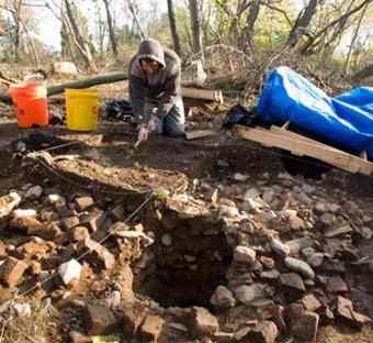Stephan Woehlke, an archeologist with the Colchester Archeological Research Team carefully removes dirt from an 18th century feature of the port town of Colchester. Stephan Woehlke, an archeologist with the Colchester Archeological Research Team carefully removes dirt from an 18th century feature of the port town of Colchester.