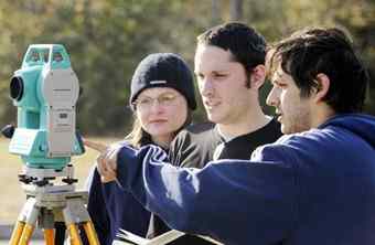 Archaeologist Daniel Bigman, right, helps Tyler Stumpf, center, and Vanessa Hanvey on Sunday while surveying at the monument. Archaeologist Daniel Bigman, right, helps Tyler Stumpf, center, and Vanessa Hanvey on Sunday while surveying at the monument.