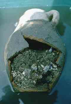 This is a Carthaginian Tophet containing burned bone fragments and soil that seeped in since burial. This is a Carthaginian Tophet containing burned bone fragments and soil that seeped in since burial.