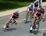 Lauren Hall (left) of Team Vera Bradley Foundation begins to fall May 9, 2010, during the Sunday Criterium of the Joe Martin Stage Race in Fayetteville, Arkansas.