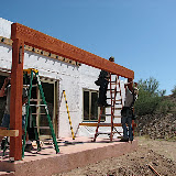 Back porch beam hoisted 9/23