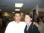 Alvaro Alvarez and his advisor Julia Lee smile after working on a scholarship essay