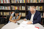 Board Member Fred Stout reviews a student budget at EPA Academy