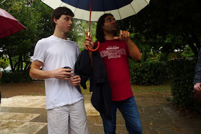 Our New Jersey friend refused to bring an umbrella or buy one. Our guide had to shelter him.