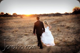 Bride and groom walking off into the sunset - Joretha Taljaard Wedding Photography
