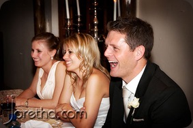 Bride and groom laughing during reception speeches - Joretha Taljaard Wedding Photography