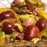 A rare treat of marinated purple baby artichokes, baby chocolate bell peppers, dehydrated green zebra tomatoes on top of nut butter spread and raw bread. Sprinkled with sea kelp, pepper, and nutritional yeast. With a squeeze of lemon to boot!