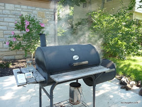 The grill with 15 pounds of pork inside