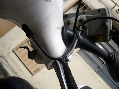 Damaged IU bracket secured to the side mirror by a cable-tie.