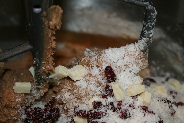 Mixing in the coconut, cranberries, and white chocolate