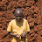 Smiling child against mud wall Smiling child against mud wall