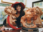 Eva Farkas-Fischhof with two sculptures in her studio