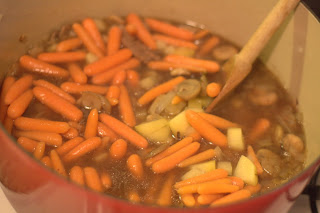 picture of potatoes and carrots added to stew