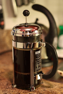 picture of french press with plunger pressed