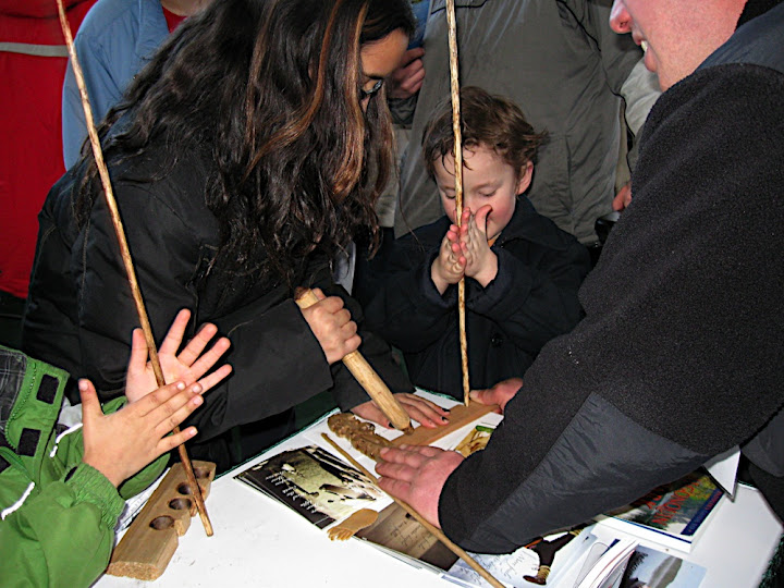 Alexis teaching about fire making