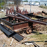 This is the rear section which has the three axles on it. Of the three axles only one was salvageable. The other two braking axles were rusted out from years in the dirt.