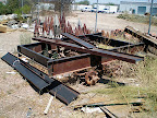 This is the rear section which has the three axles on it. Of the three axles only one was salvageable. The other two braking axles were rusted out from years in the dirt.