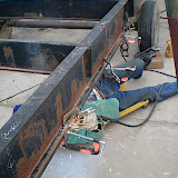 With the new length of the trailer finalized (34' bed), we had to weld on new axle mounts based on the trailer length. The suggested formula from the mobile home haulers was 1/2 of the bed length (34'/2=17')and then add 1" per foot of bed past the centerline towards the rear (34" back from the centerline). This will give the trailer enough tongue weight but keep sit close to the center of gravity.