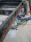 With the new length of the trailer finalized (34' bed), we had to weld on new axle mounts based on the trailer length. The suggested formula from the mobile home haulers was 1/2 of the bed length (34'/2=17')and then add 1" per foot of bed past the centerline towards the rear (34" back from the centerline). This will give the trailer enough tongue weight but keep sit close to the center of gravity.