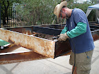 I'm using a plasma cutter to clean up all the sharp edges on the trailer.