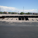 The trailer is 34' long along the bed, and the hitch is about 4' for a total of 38' long.