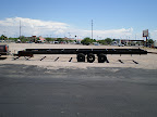 The trailer is 34' long along the bed, and the hitch is about 4' for a total of 38' long.