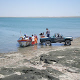Here the local fisherman are off loading their crabs and mollusks into a pickup truck.