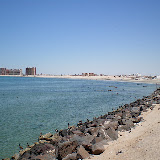 To the south is sandy beach with a rocky coast interspersed. There are resorts and hotels scattered along the coast.