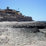 The homes are built right up to the high tide line along the rocky coast.