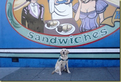 Reyna sitting out front of Tommys Joint in SF. 