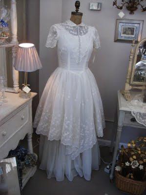 display the gown in her living room or bedroom on a dress form