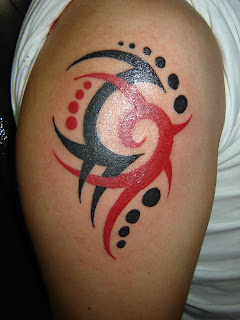 Black and red tattoo flash on a quarter sleeves