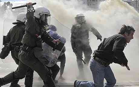 Demonstrator strife with demonstration troops in front of  the Greek council in Athens