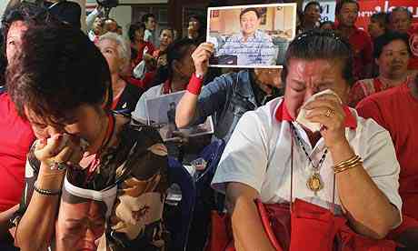 Supporters of former Thai budding apportion Thaksin Shinawatra cry at the outcome to seize his solidified assets