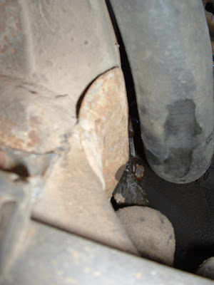 Here you can see (sorta) the idler arm bracket bolted to the otherside of the frame.  The bolts are a little tricky to get to, but the radiator hose has enough give to make it doable.