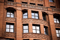 Facing the Sun: They don't build them like they used to - the detailing on the facade is what caught my attention - it truly is amazing. (1/1250 sec @ f/1.8; 50mm) Copyright 2009, Kerri Shotts