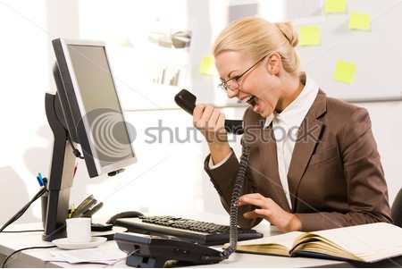 [stock-photo-photo-of-aggressive-secretary-shouting-into-phone-receiver-while-sitting-in-office-22190917[4].jpg]