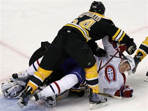 Adam McQuaid knocking Travis Moen to the ice