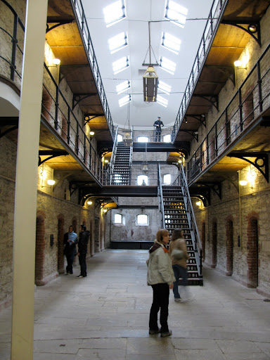 Inside the Gaol - the dude at the top of the stairs is a Warden