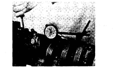 Seating the thrust bearings before tightening the main bearing caps by moving the crankshaft endwise with a pry.