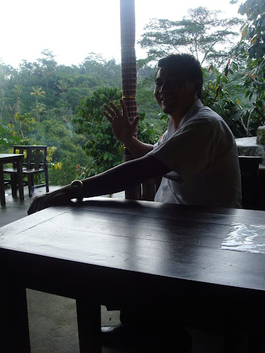 Ketut, a Hindu Balinese tour guide, enjoys the view over the Balinese rice terraces.
