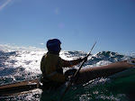 It's time for your close up. Into the sun on a blustery summer storm paddle on Lake Michigan. htttp://keithwikle.com