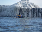 Pastor Van Doren paddling out of the Kalamazoo river into an ice filled Lake Michigan. http://keithwikle.com
